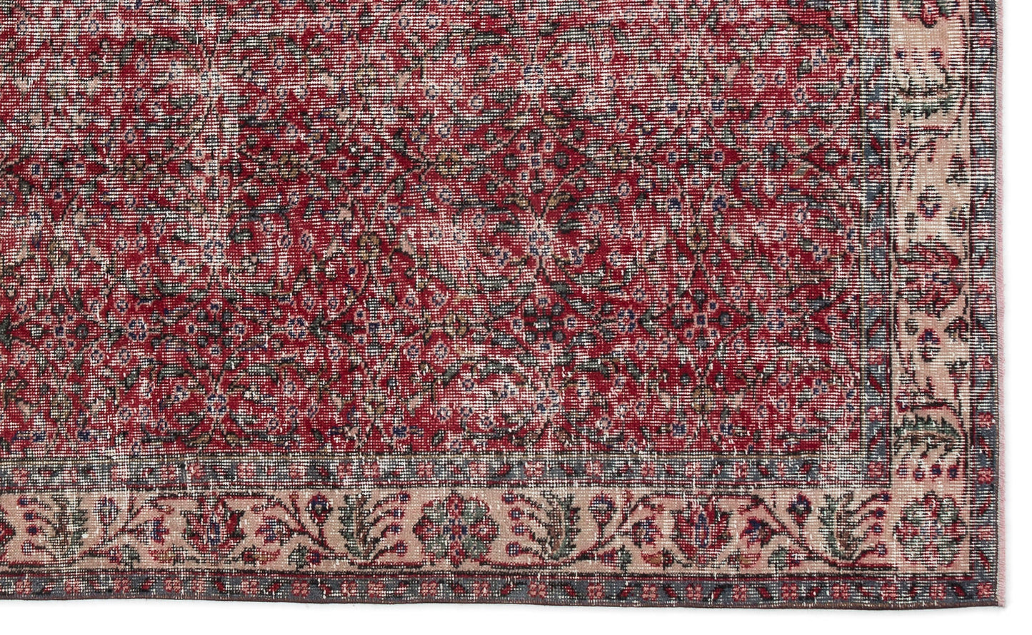 Distressed red and cream traditional rug with a dense floral medallion pattern and a wide decorative border.