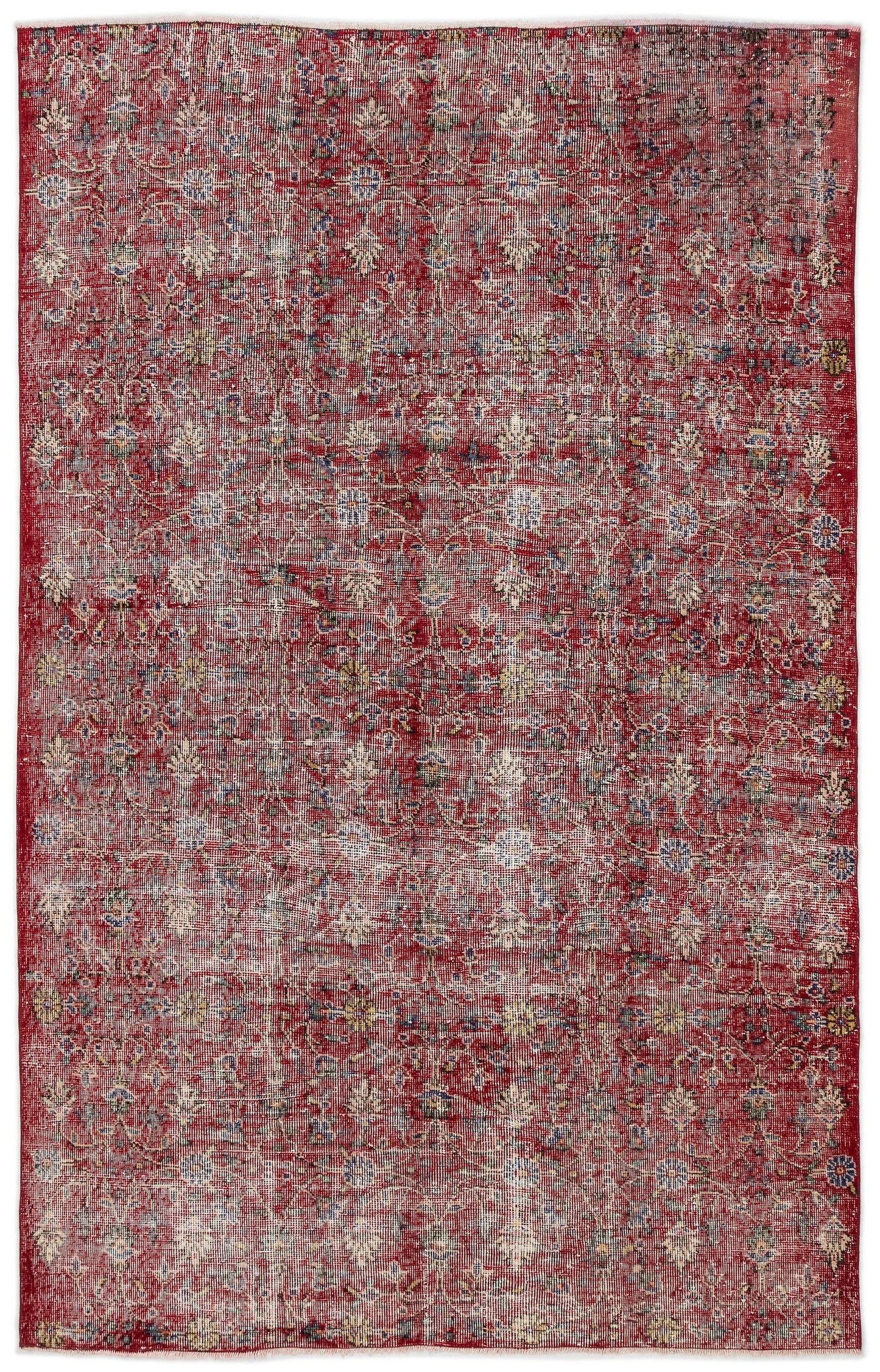 Distressed red vintage-style rug with an all-over faded floral pattern in cream, blue, and yellow accents.