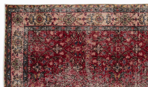 Load image 1 in gallery view. Deep red traditional rug with a floral medallion pattern and a multi-colored decorative border.