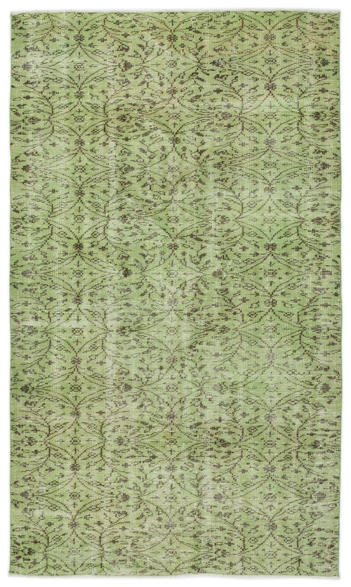 Load image 1 in gallery view. Sage green distressed rug with a dark brown repeating floral trellis pattern.