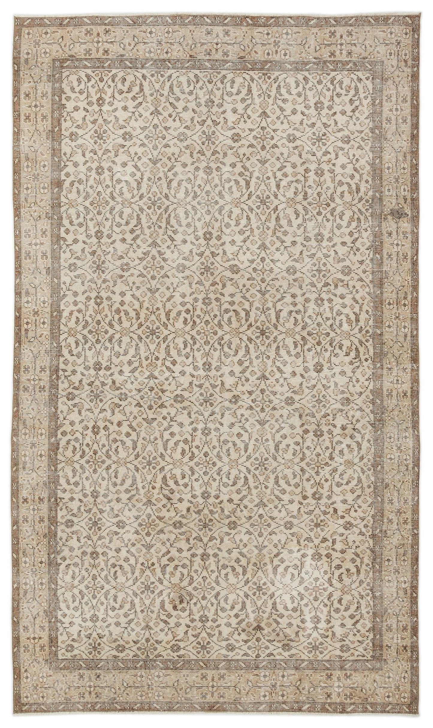 The Pavia - Vintage Floral Rug (5'7 x 9'5) is a rectangular Anatolian hand-woven piece with an intricate, symmetrical floral and vine pattern in beige, cream, and light brown, framed by detailed geometric and floral borders.