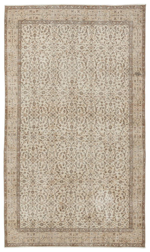 Load image 1 in gallery view. The Pavia - Vintage Floral Rug (5'7 x 9'5) is a rectangular Anatolian hand-woven piece with an intricate, symmetrical floral and vine pattern in beige, cream, and light brown, framed by detailed geometric and floral borders.