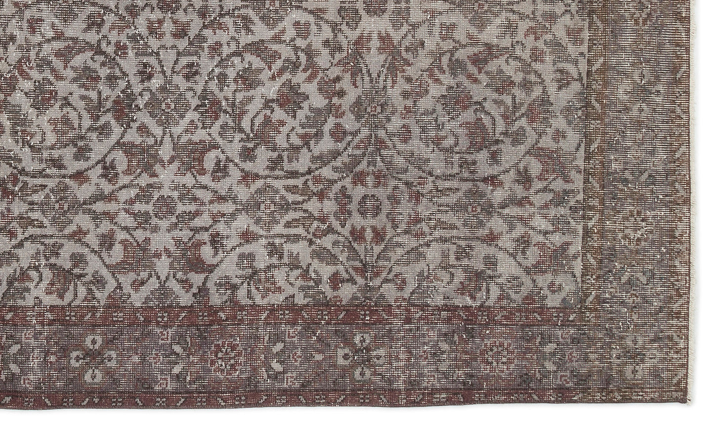 Distressed grey and rust-red rug with a traditional floral medallion pattern and a wide, ornate border.