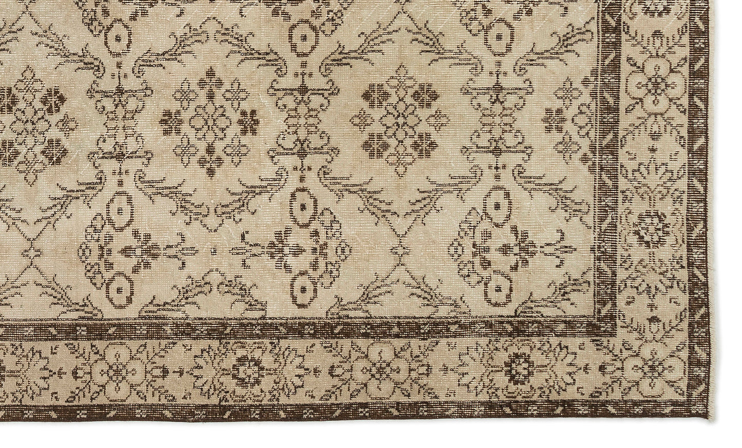 Beige and dark brown rug with a traditional floral medallion pattern and a decorative border.