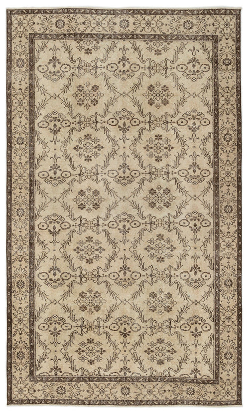 Load image 1 in gallery view. Beige and dark brown traditional rug with a repeating floral medallion pattern and a decorative border.