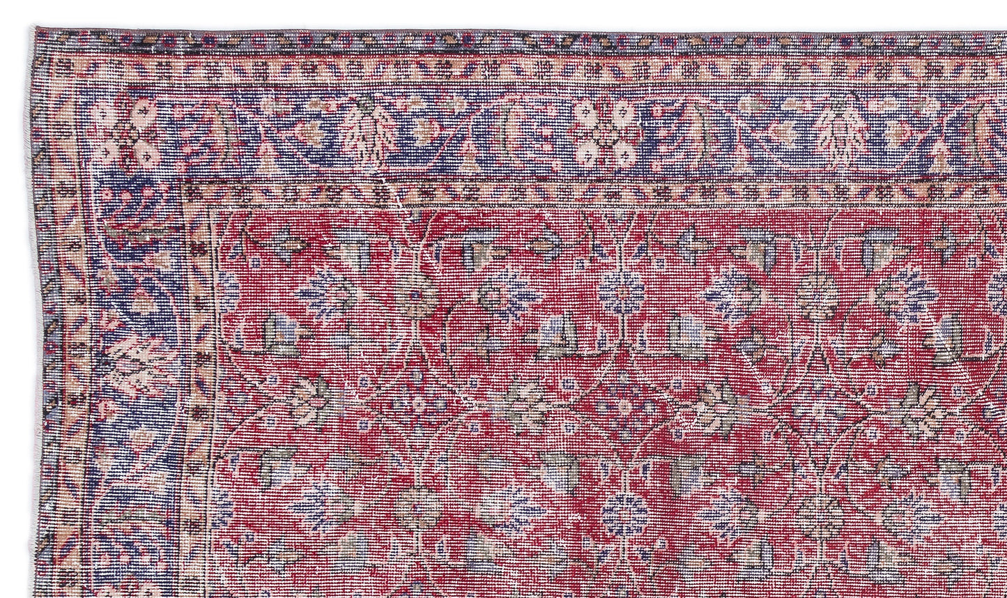 Red and blue traditional Persian-style rug with a floral vine pattern and a decorative border.