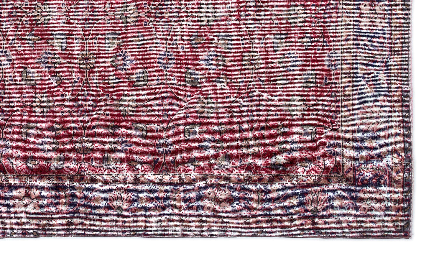 Red and blue traditional rug with a distressed floral medallion pattern and a detailed border.