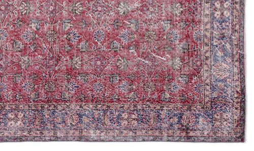 Load image 1 in gallery view. Red and blue traditional rug with a distressed floral medallion pattern and a detailed border.