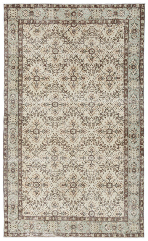 Load image 1 in gallery view. Beige, brown, and sage green traditional rug with a repeating floral medallion pattern and a decorative border.