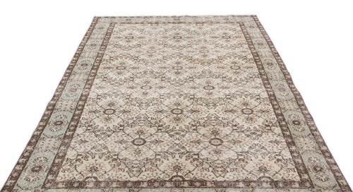 Load image 1 in gallery view. Beige and brown vintage-style rug with a distressed floral medallion pattern and a wide decorative border.