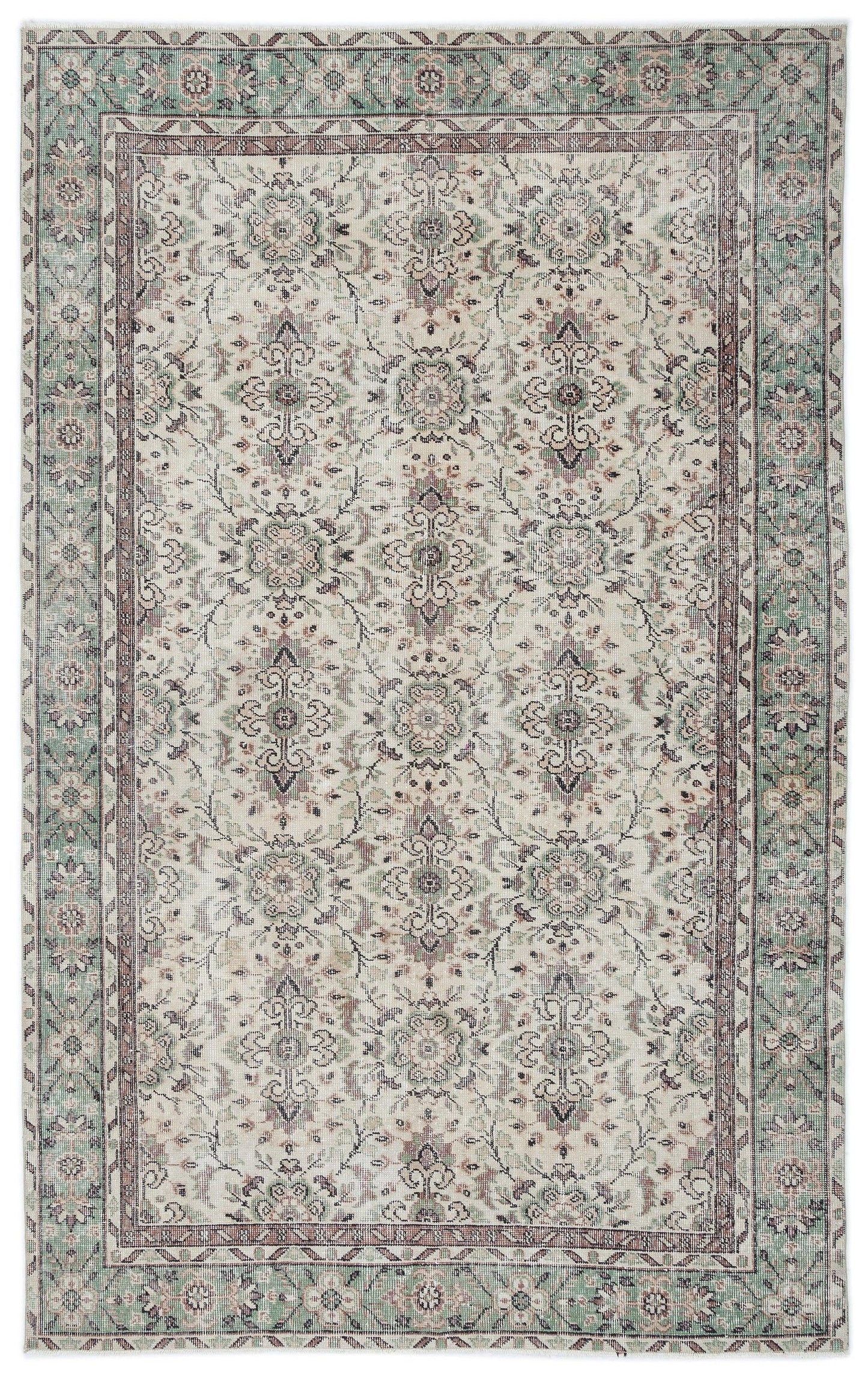 Cream, sage green, and mauve traditional rug with a distressed floral medallion pattern and a decorative border.