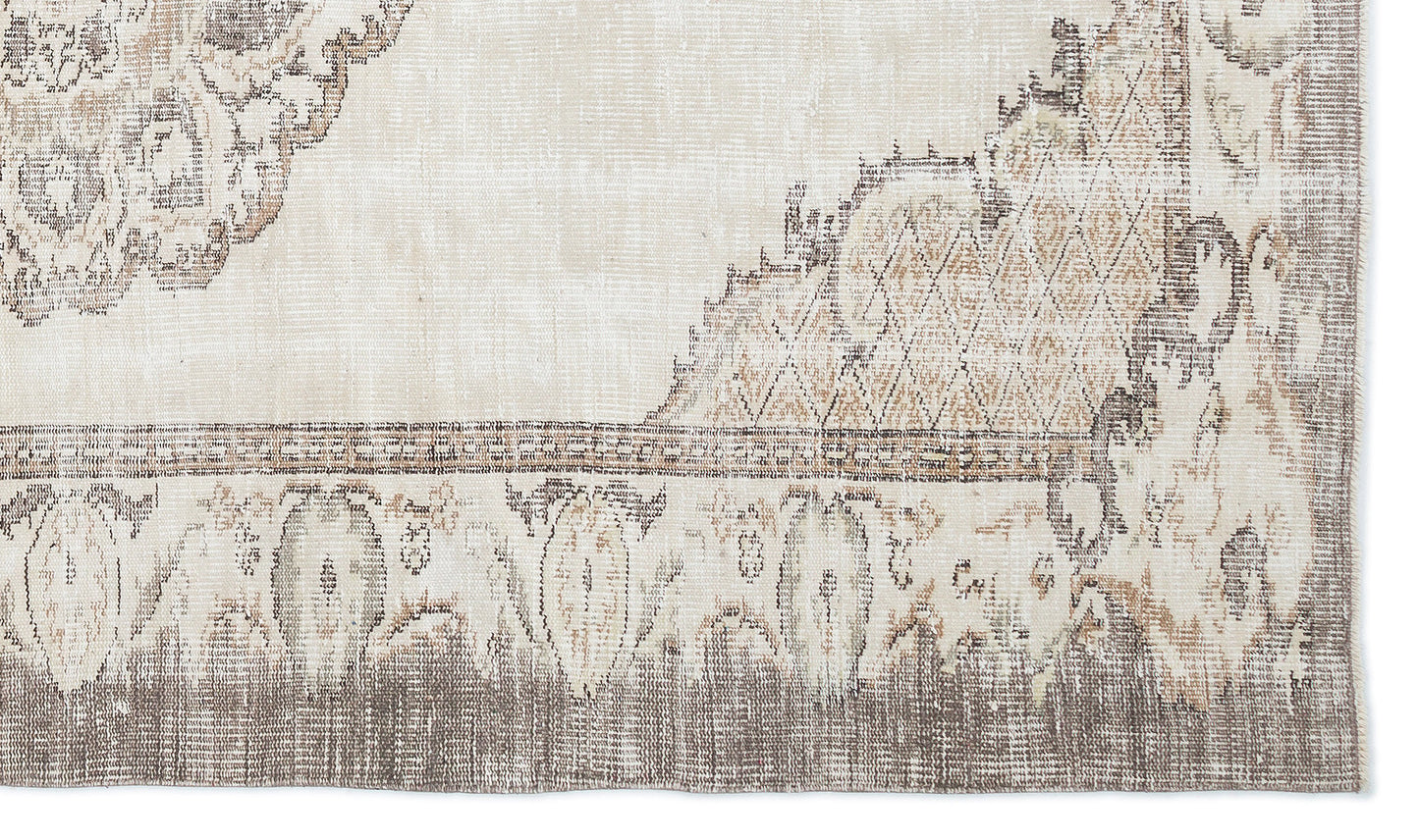 Beige and taupe distressed rug with a faded traditional medallion pattern and geometric border.