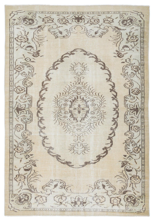 Load image 1 in gallery view. Beige and brown traditional rug with a central floral medallion and ornate border pattern.