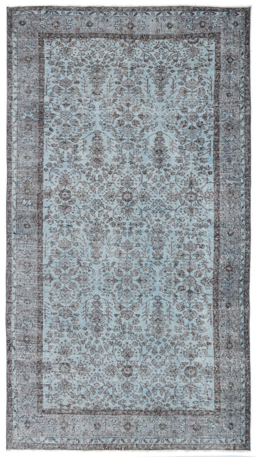 Load image 1 in gallery view. Light blue and charcoal grey traditional rug with a distressed floral medallion pattern and a wide border.