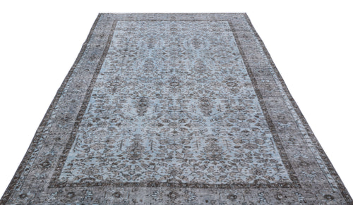 Load image 1 in gallery view. Light blue and charcoal grey distressed rug with a traditional ornate medallion pattern and a wide border.