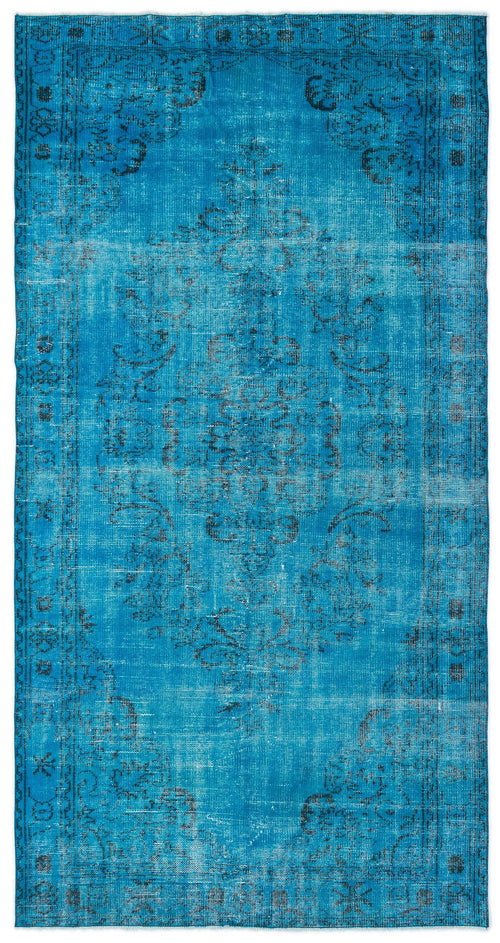 Load image 1 in gallery view. Bright blue distressed rug with a dark grey traditional floral medallion pattern and a decorative border.