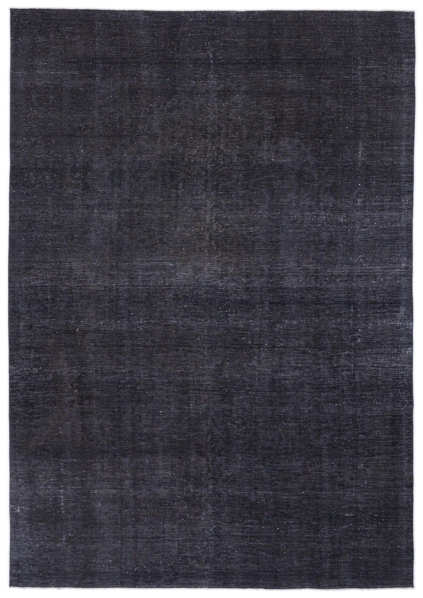 Solid charcoal grey rug with a distressed, low-pile texture and subtle horizontal grain.