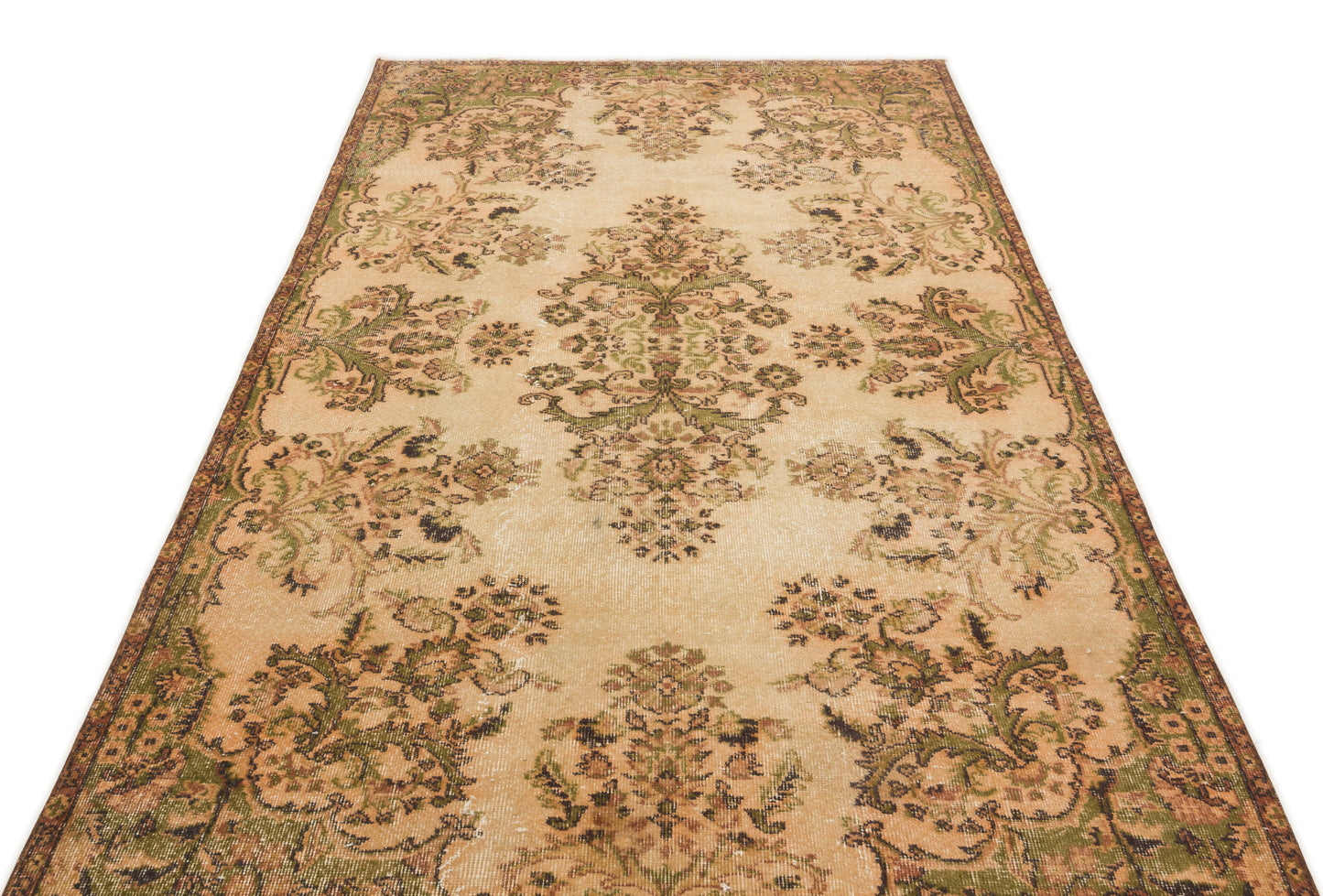 Beige and olive green vintage-style rug with a distressed floral medallion pattern on a white background.