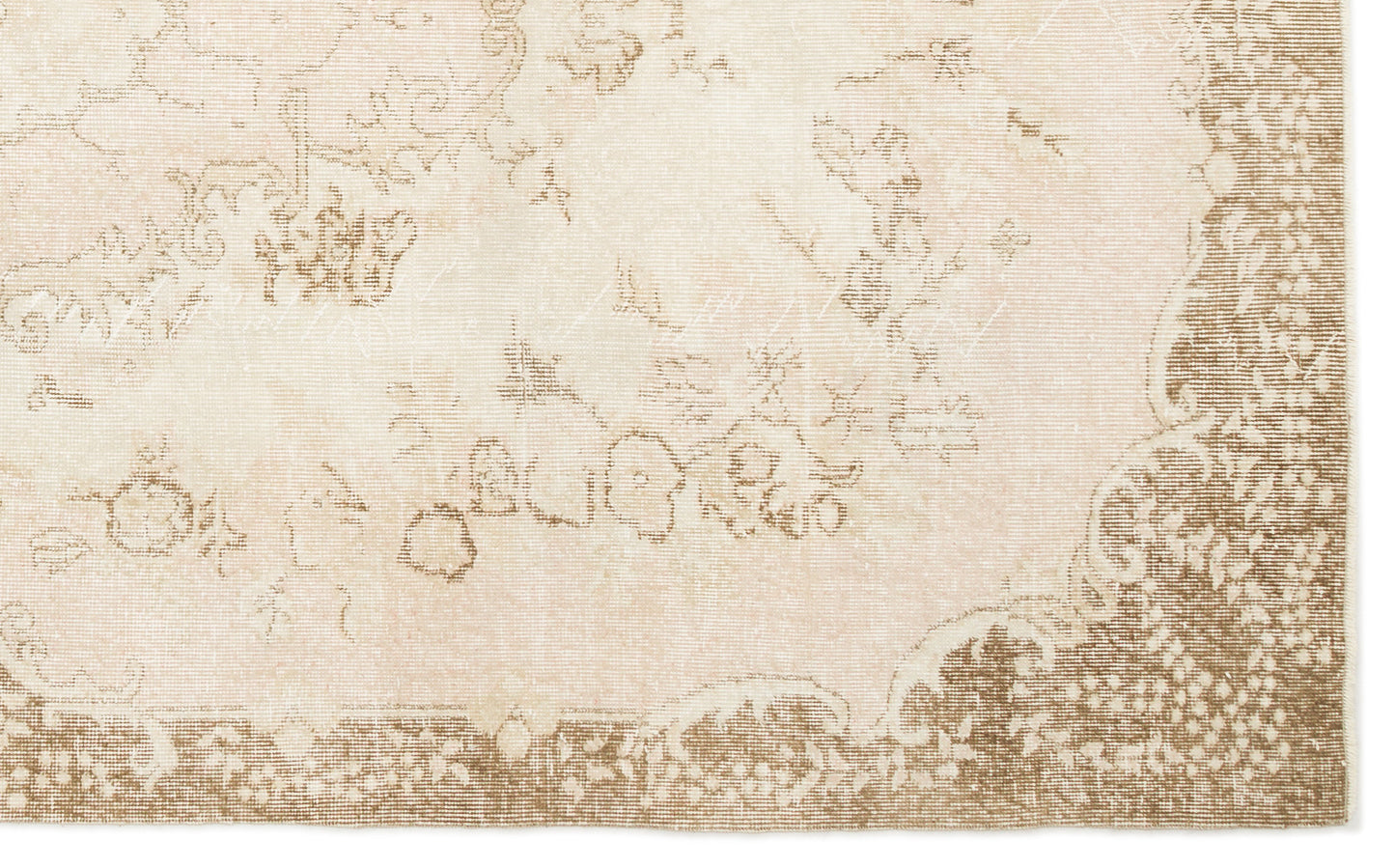 Beige and cream rug with a faded, distressed traditional floral medallion pattern and a wide decorative border.