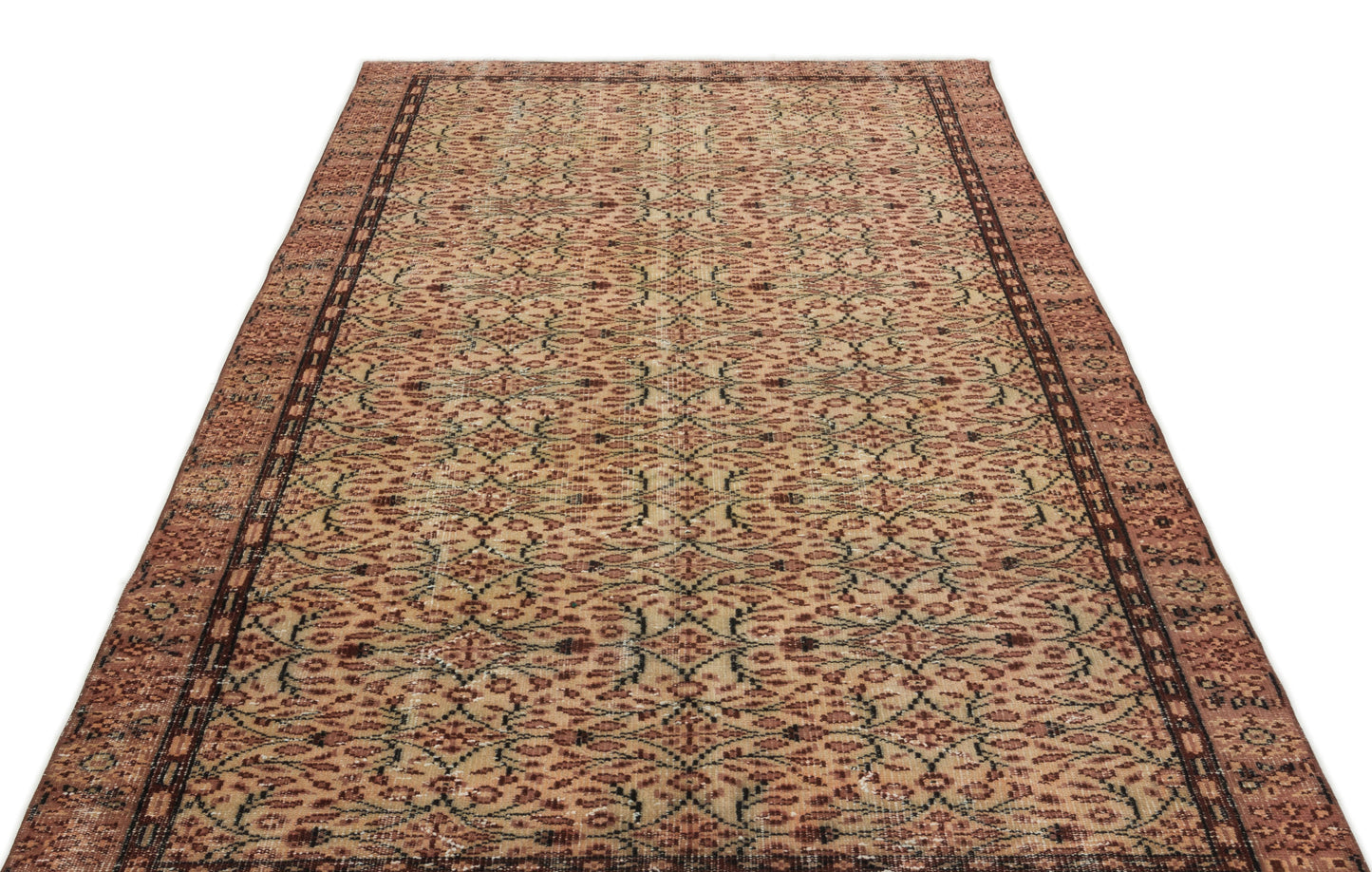 Distressed terracotta and beige rug with a repeating floral lattice pattern and a dark brown border.