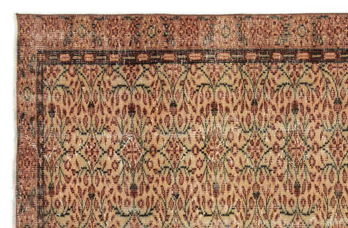 Load image 1 in gallery view. Rust and beige vintage-style rug with a repeating floral trellis pattern and a decorative border.