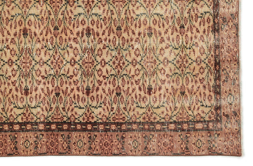 Load image 1 in gallery view. Tan and terracotta vintage-style rug with a repeating floral lattice pattern and a decorative border.