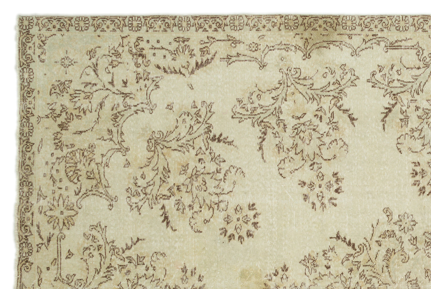 Beige and brown vintage-style rug with a distressed floral pattern and a decorative border.