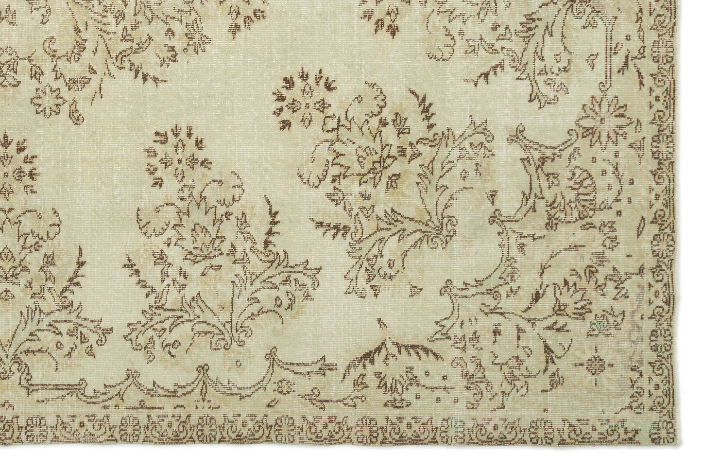 Beige and brown vintage-style rug with a distressed floral pattern and a decorative border.