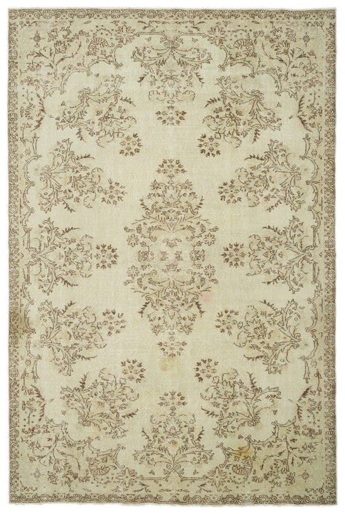 Load image 1 in gallery view. Beige and brown distressed rug with a central floral medallion and repeating botanical motifs within a decorative border.