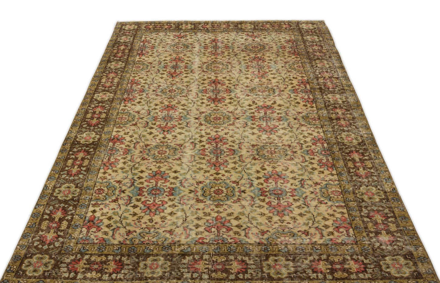 Distressed beige rug with a traditional floral medallion pattern in red, blue, and brown, isolated on a white background.