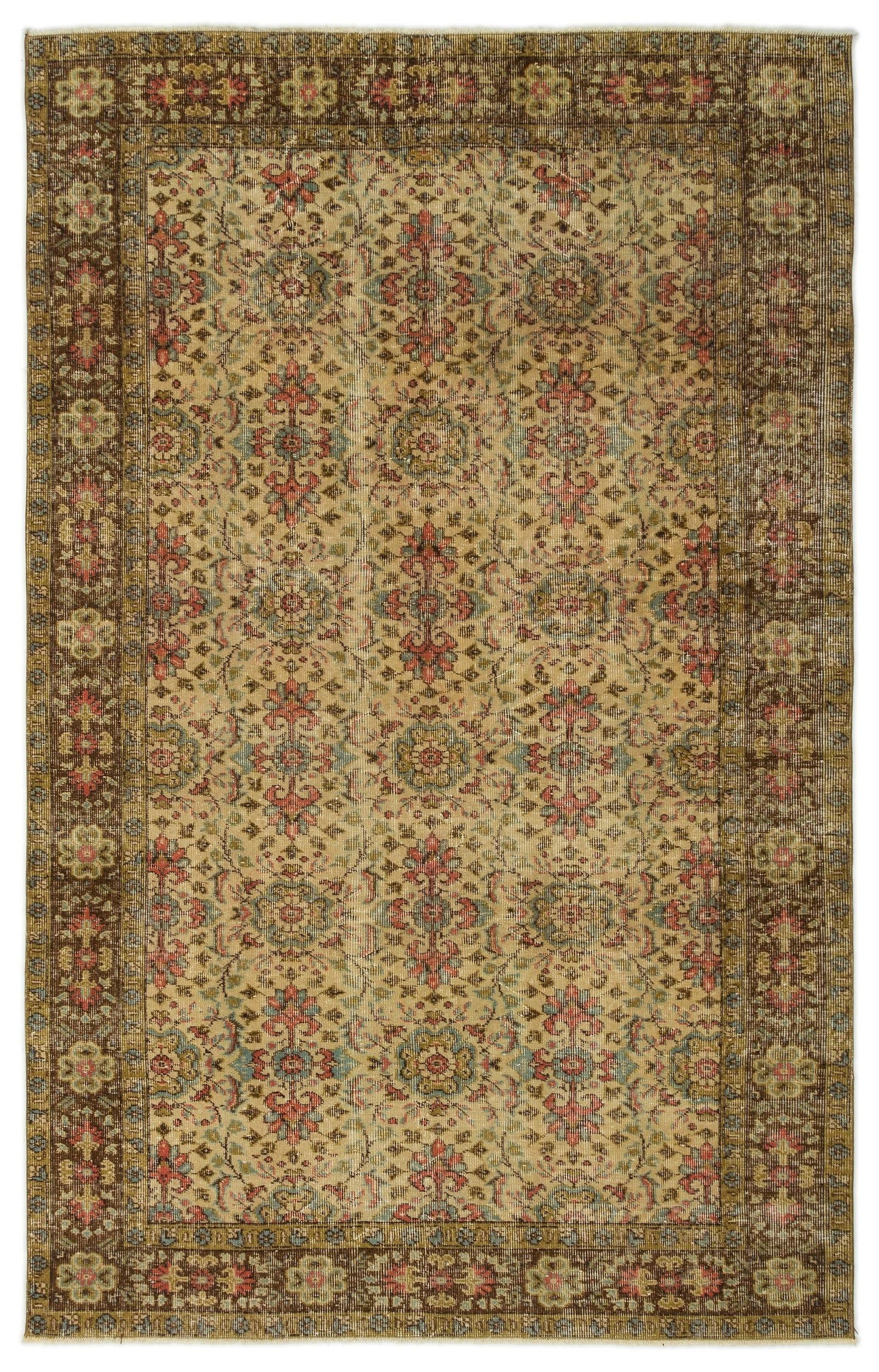 Distressed beige rug with a repeating floral medallion pattern in muted red, blue, and brown, featuring a wide border.