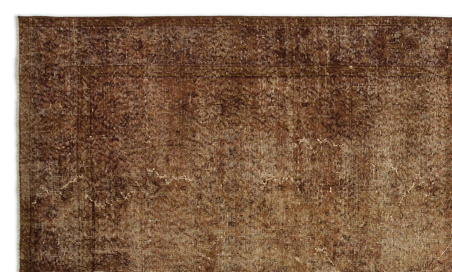 Dark brown distressed rug with a faded traditional border and subtle, worn-in medallion pattern.