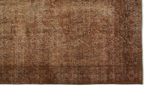 Load image 1 in gallery view. Distressed brown rug with a faded traditional medallion pattern and a wide, ornate border.