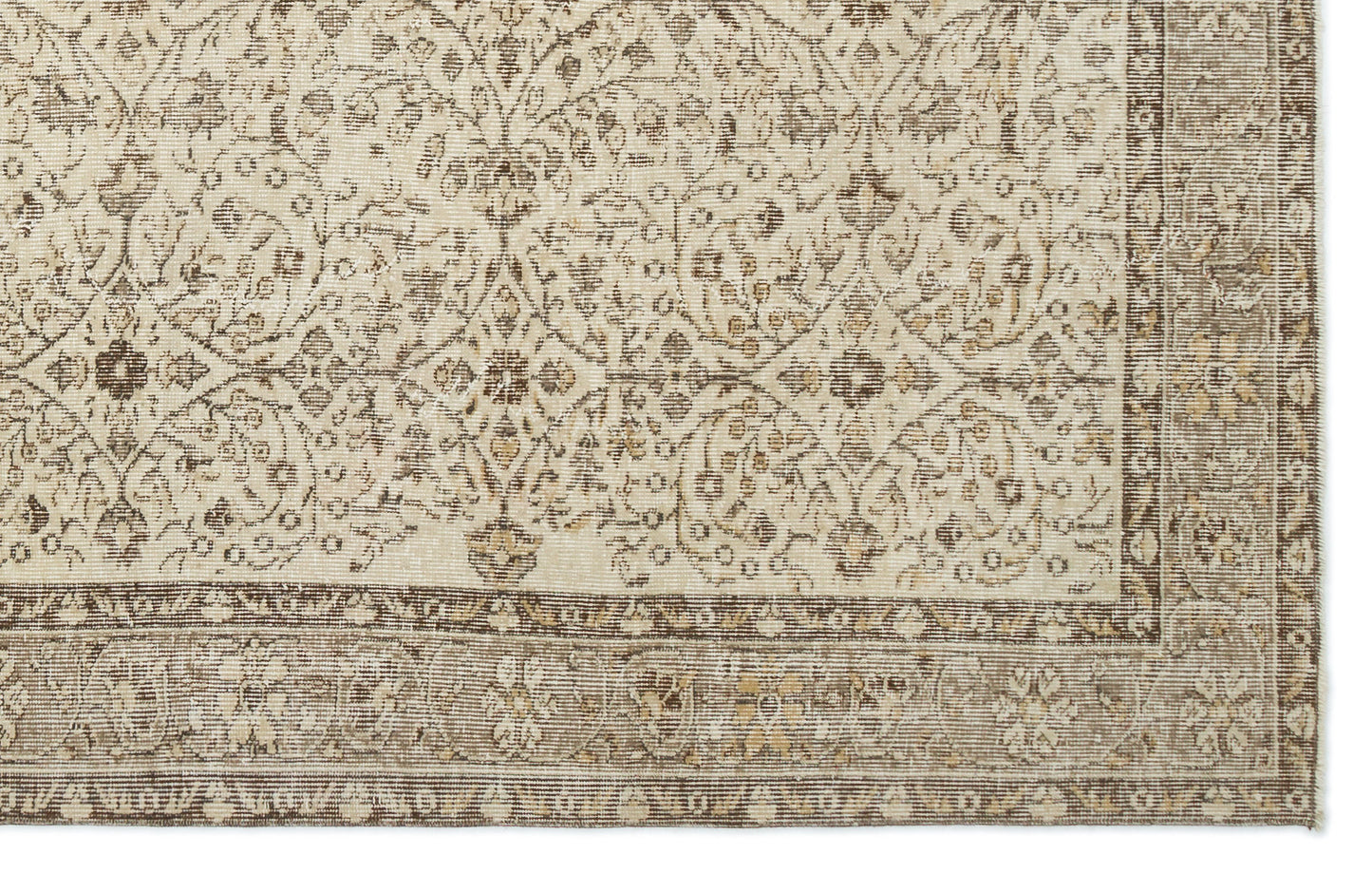 Beige and brown rug with a distressed traditional floral medallion pattern and a wide decorative border.