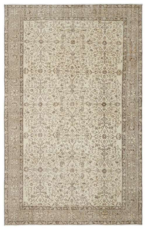 Load image 1 in gallery view. Beige and brown traditional rug with a distressed floral medallion pattern and a wide decorative border.
