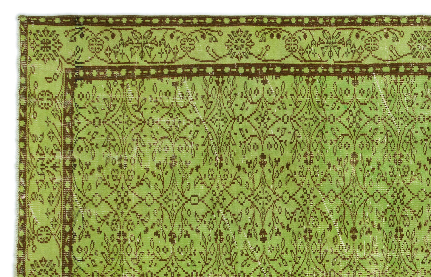 Lime green and brown vintage-style rug with a distressed floral medallion pattern and a decorative border.