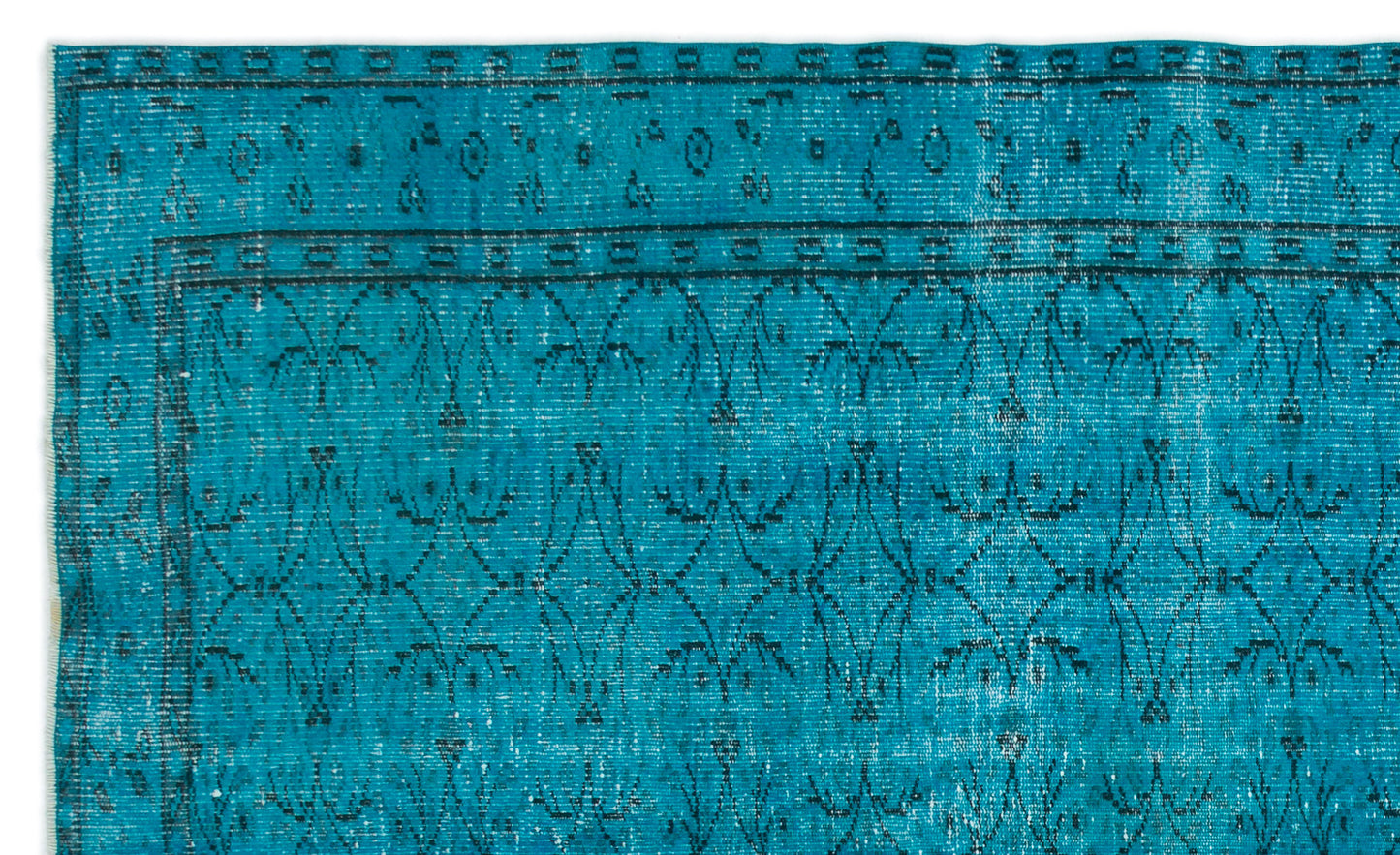 Teal rug with a distressed black geometric floral pattern and a bordered edge on a white background.