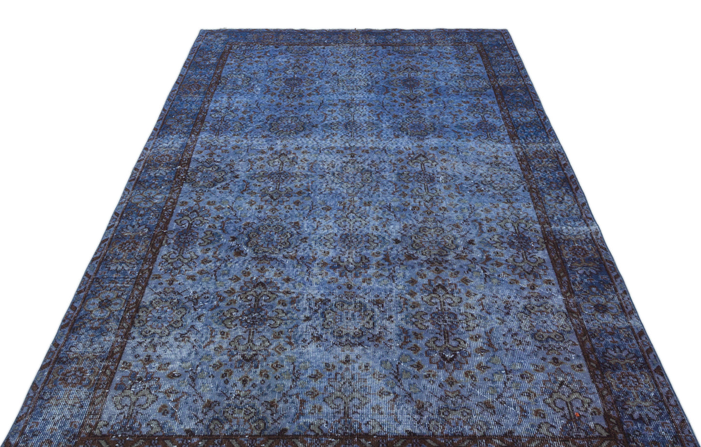 Blue and dark brown distressed traditional rug with an intricate floral medallion pattern on a white background.