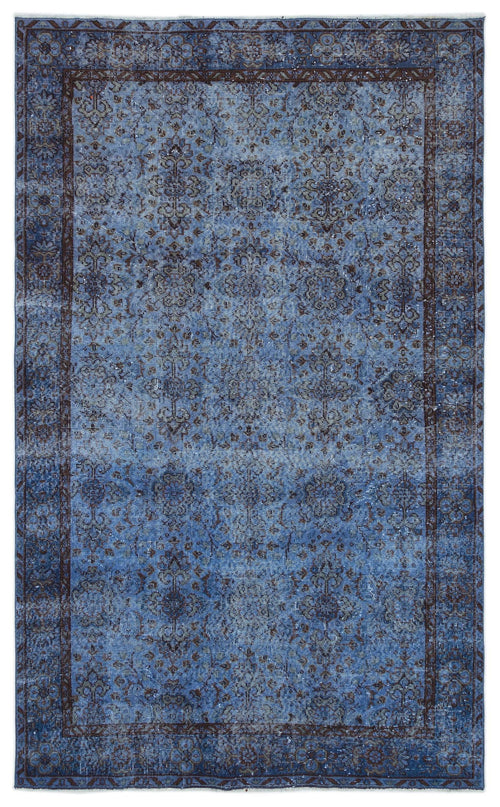 Load image 1 in gallery view. Distressed blue and dark brown traditional rug with an ornate floral medallion pattern and a wide decorative border.