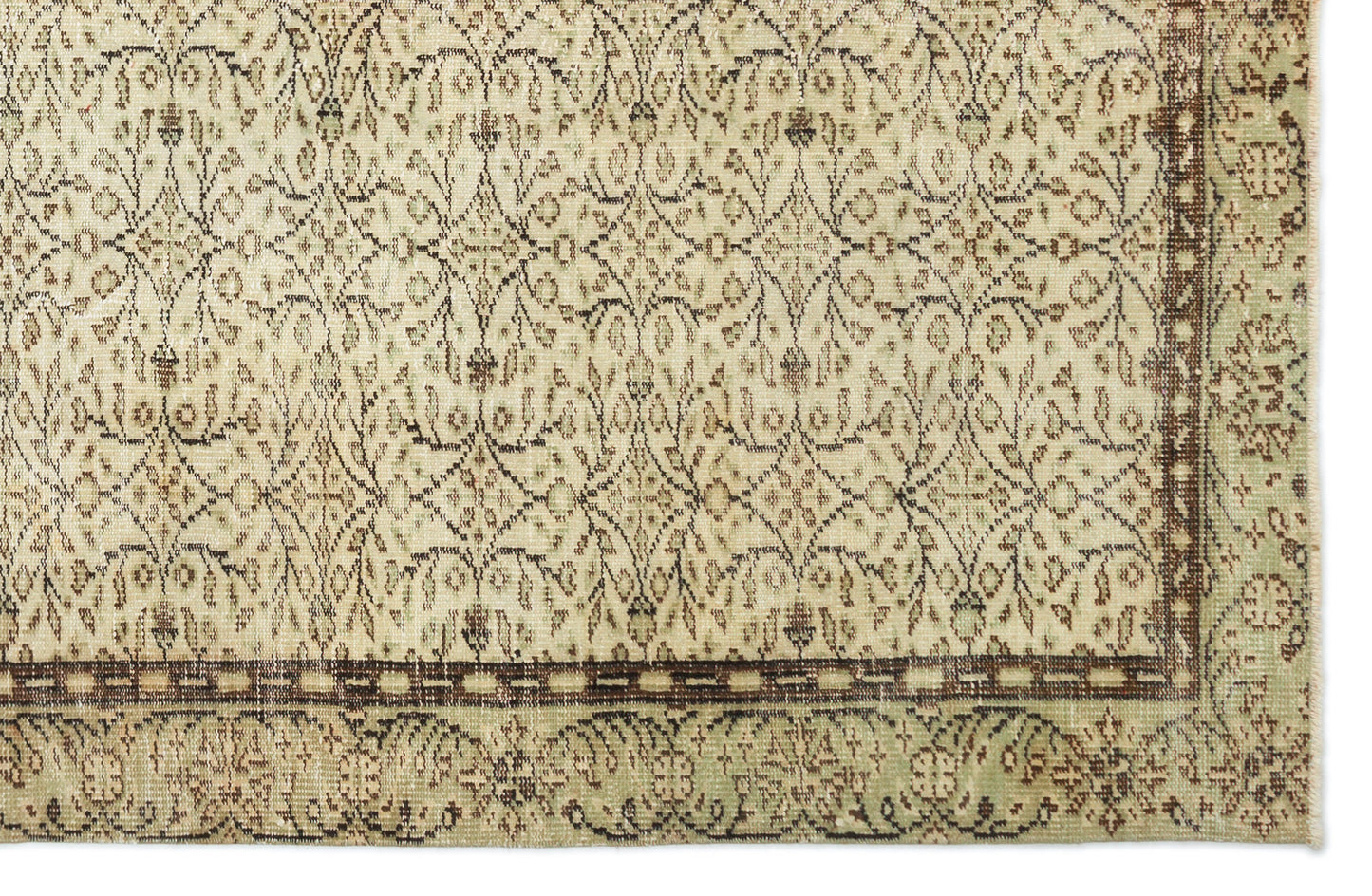 Beige and sage green rug with a dark brown floral trellis pattern and a wide decorative border.