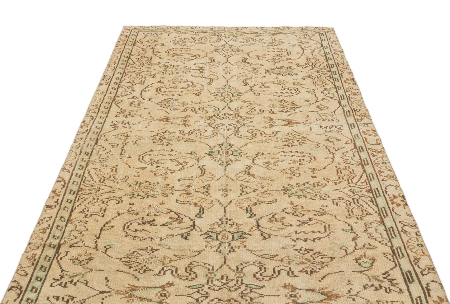 Beige and brown vintage-style rug with a distressed floral medallion pattern and a decorative border.