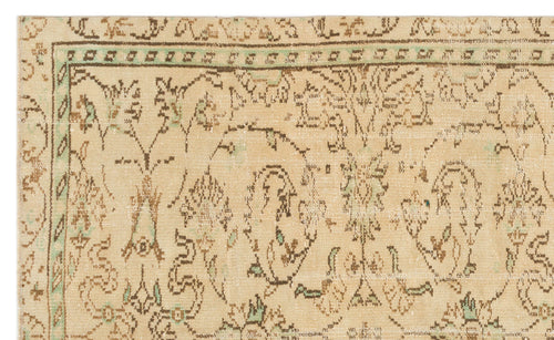 Load image 1 in gallery view. Beige vintage-style rug with brown and sage green floral motifs and a geometric border.