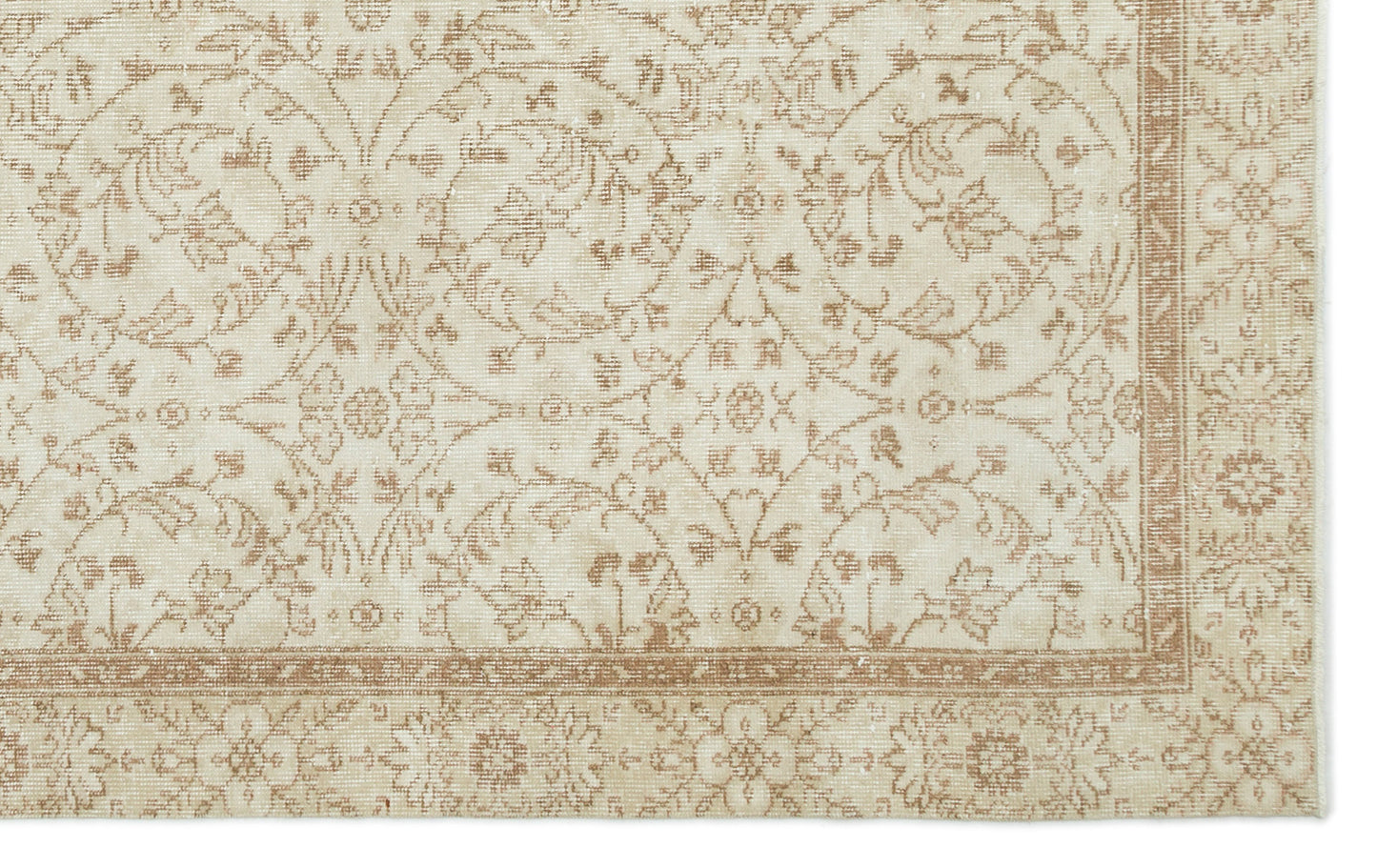 Beige and cream rug with a distressed traditional floral vine pattern and a decorative border.