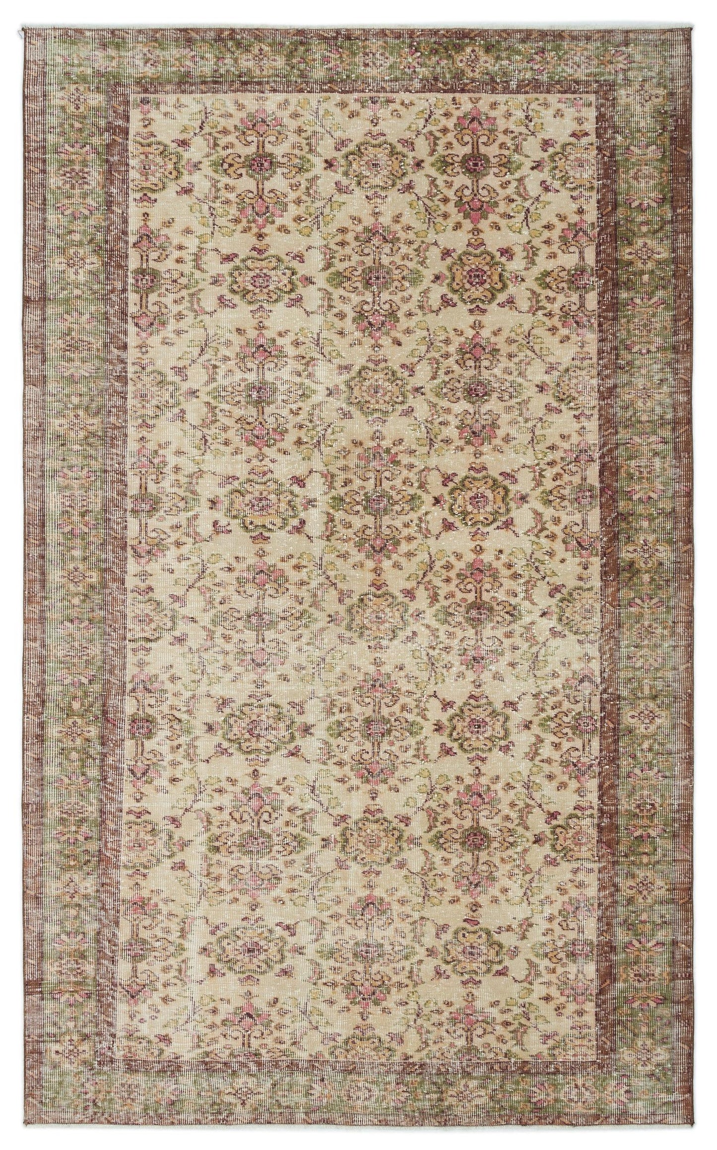 Beige vintage-style rug with a distressed floral medallion pattern in muted pink, green, and brown tones.