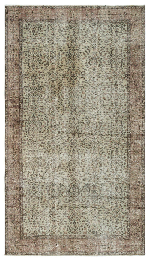 Load image 1 in gallery view. Sage green and brown distressed area rug with a traditional floral vine pattern and a wide border.