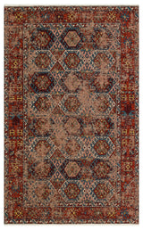 The Nomad Spirit - Washable Kilims - AND03 is a rectangular flatwoven rug with a distressed vintage look, showcasing tribal geometric patterns in red, blue, beige, and gold, framed by a border of symmetrical diamonds and octagons