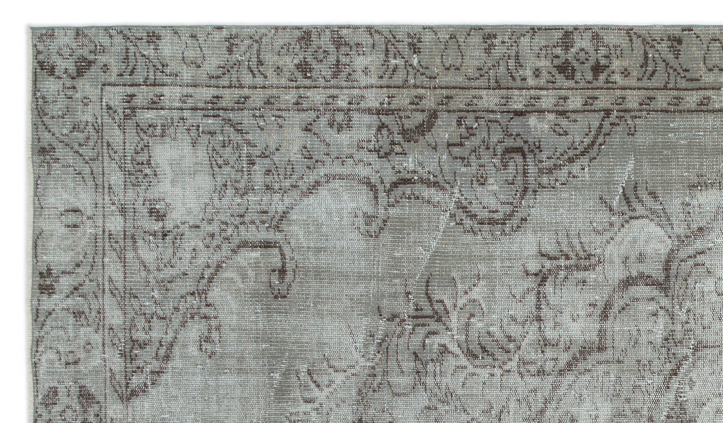 Grey and brown distressed rug with a traditional ornate floral border and medallion pattern.