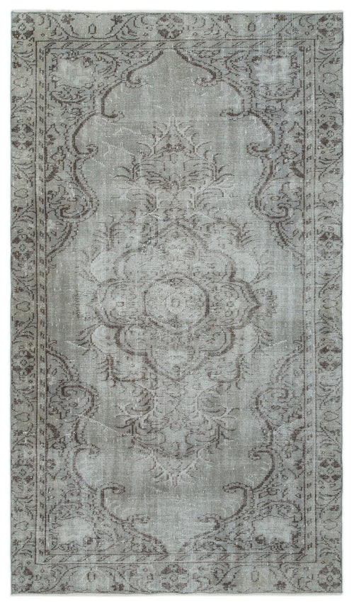 Load image 1 in gallery view. Grey and taupe distressed traditional rug with a central floral medallion and ornate border pattern.