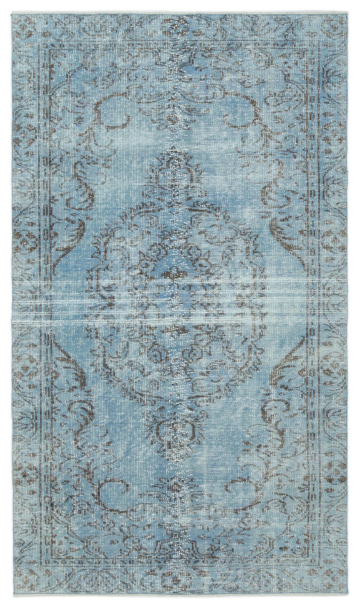 Light blue and grey distressed rug with a traditional central medallion and ornate border pattern.
