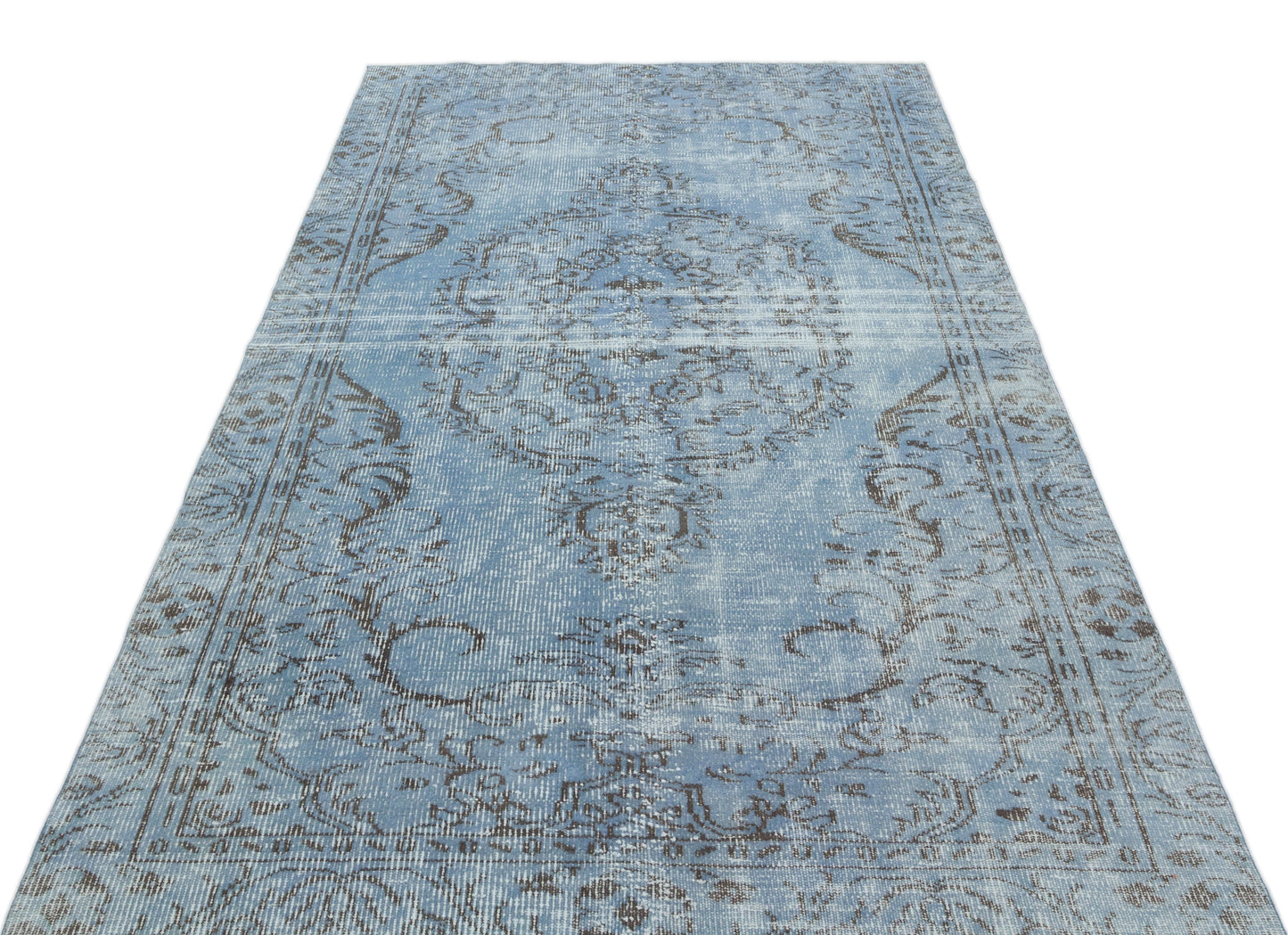 Light blue and charcoal distressed rug with a traditional central medallion and ornate border pattern.